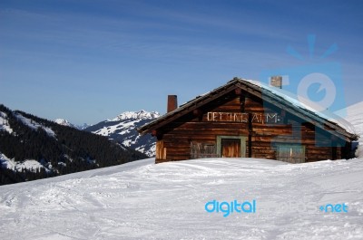 An Old Mountain Shelter House Covered With Lots Of Snow Stock Photo