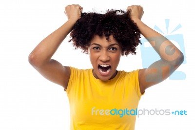 Angry Young Woman Pulling Her Hair Out Stock Photo