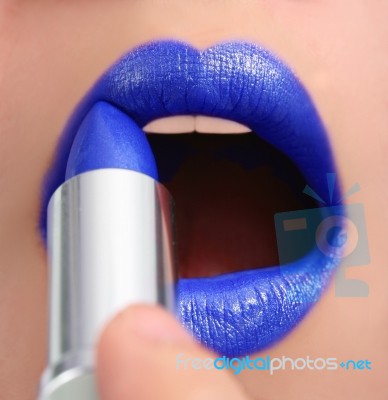 Applying Blue Lipstick Stock Photo