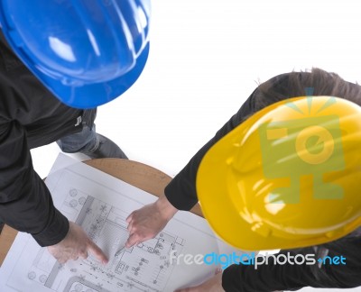 Architects discussing with plan Stock Photo