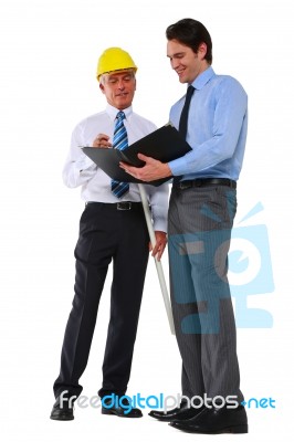 Architects In Discussion Stock Photo