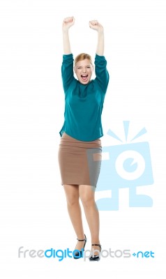 Arms Raised Young Woman Stock Photo