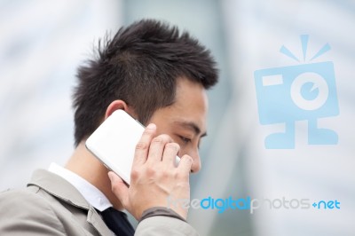 Asia Business Man Using A Mobile Phone With Copyspace Stock Photo
