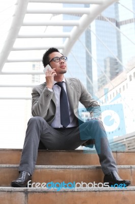 Asia Businessman Using A Mobile Phone Stock Photo