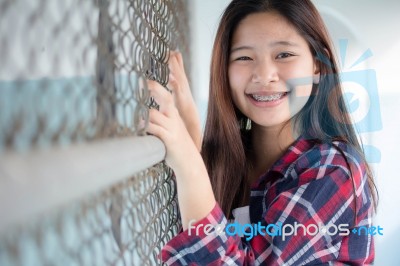 Asia Thai Teenager Women Scotch T-shirt Relax And Smile Stock Photo