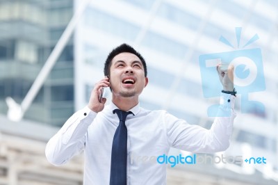 Asian Business Man Speaking Mobile Phone Stock Photo