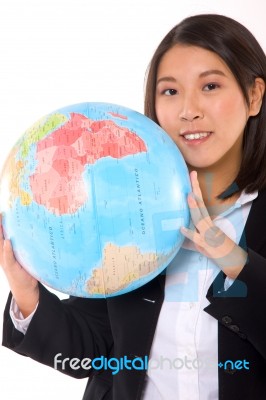 Asian Businesswoman With Globe Stock Photo