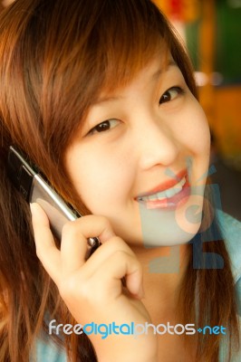 Asian Girl And Mobile Phone Stock Photo