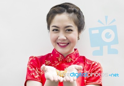 Asian Woman Holding Gold Ingot Stock Photo