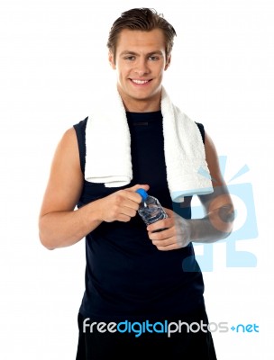 Athlete man holding Water Bottle Stock Photo