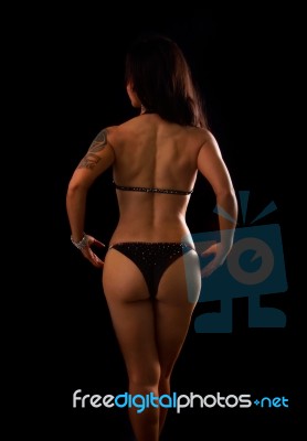 Athletic Asian Woman Showing Muscles Of The Back Stock Photo
