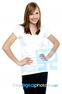 Attractive Teenager Posing Casually, Hands On Waist Stock Photo