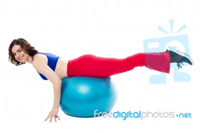 Attractive Woman Exercising With Swiss Ball Stock Photo