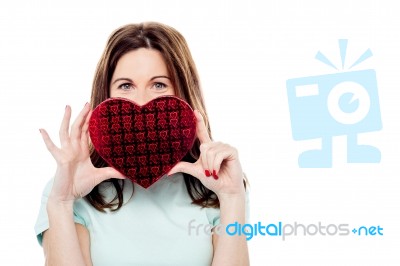 Attractive Woman With Gift Box In Form Of Heart Stock Photo