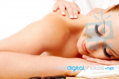 Attractive Young Lady Getting A Massage Stock Photo