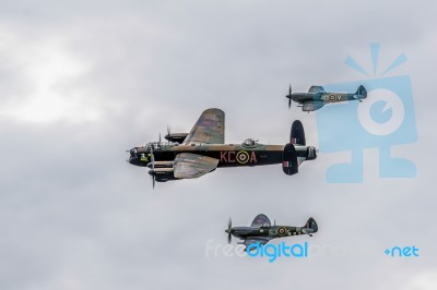 Avro Lancaster Flanked By Two Spitfires Stock Photo