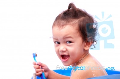 Baby And Toothbrush Stock Photo