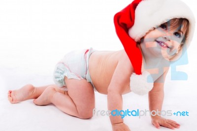 Baby Crawling With Santa Cap Stock Photo