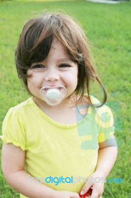 Baby Girl With Pacifier Stock Photo