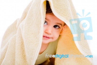Baby Looking Out From Under His Blanket Stock Photo