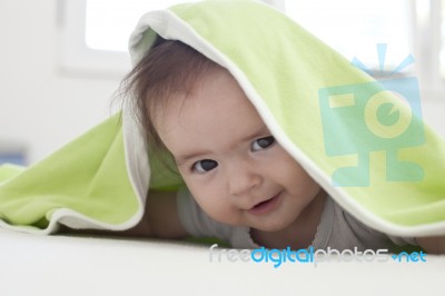 Baby Under Blanket Stock Photo