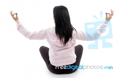 Back Pose Of Female In Lotus Pose On White Background Stock Photo