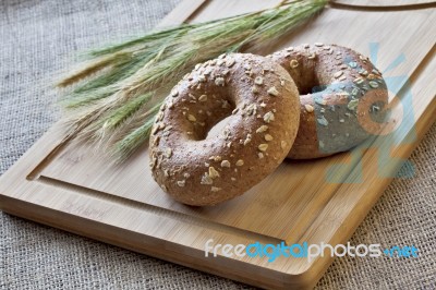 Bagels On Bread Board Stock Photo