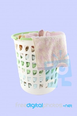 Basket Of Cloth Hang Before Washing On Blue Background Stock Photo