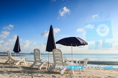 Beach Chairs And Umbrellas Stock Photo
