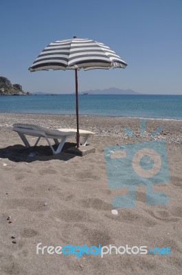 Beach Umbrella And Chair Stock Photo