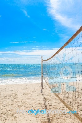 Beach Volleyball Net On The Beach With Blue Sky Stock Photo