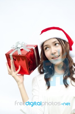 Beautiful Asian Santa Woman Showing Gift Stock Photo