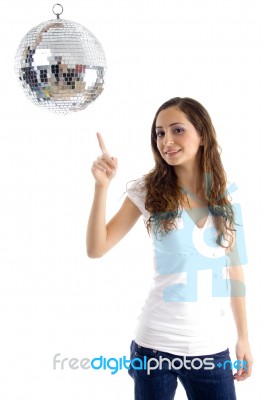 Beautiful Female Pointing At Mirror Ball Stock Photo