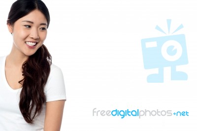 Beautiful Smiling Asian Model Looking Away Stock Photo