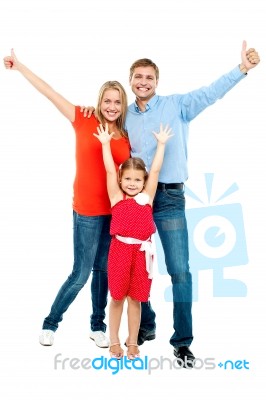 Beautiful Smiling Family. Father, Mother And Daughter Stock Photo