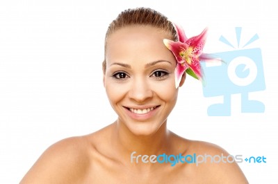 Beautiful Smiling Woman With A Lily Stock Photo