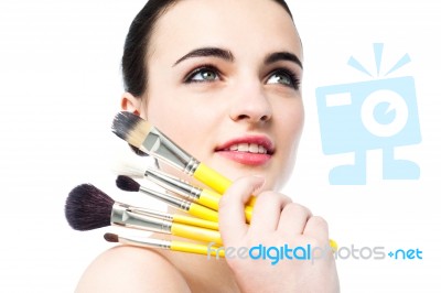 Beautiful Teen Girl Holding Makeup Brushes Stock Photo