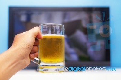 Beer In Front Of The Television Stock Photo