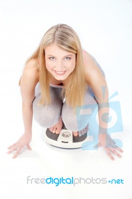 Blond Girl On Scale Stock Photo