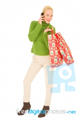 Blonde Christmas Shopper On Phone Stock Photo