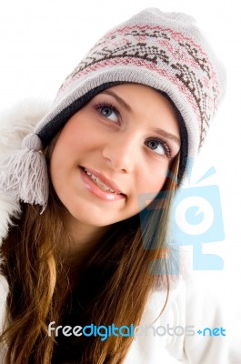 Blonde Female With Cap And Looking Upward Stock Photo