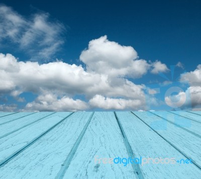 Blue Plank And Cloudy Sky Stock Photo
