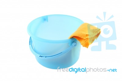 Blue Plastic Bucket And Yellow Cloth Stock Photo