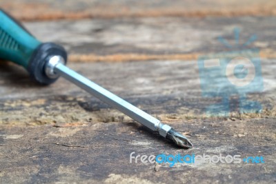 Blue Screwdriver Isolated On Wooden Stock Photo