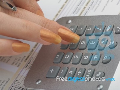 Bookkeeping With Calculator Stock Photo