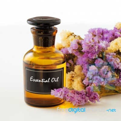 Bottle Of Essential Oil With Flower Stock Photo