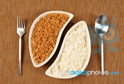 Bowl Of Brown And White Rice Stock Photo