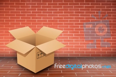Box By Brick Wall Stock Photo