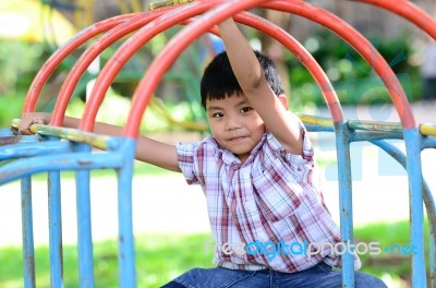 Boy At Playground Stock Photo