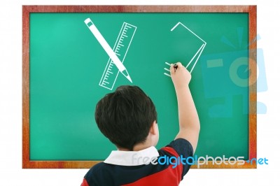 Boy Drawing In Chalkboard Stock Photo